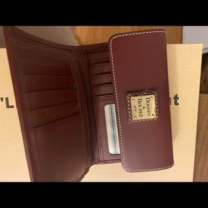 Mila burgundy dooney and burke wallet, used multiple times but it good condition